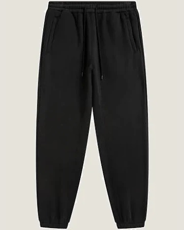 Black tapered joggers with elastic cuffs and drawstring, flat lay