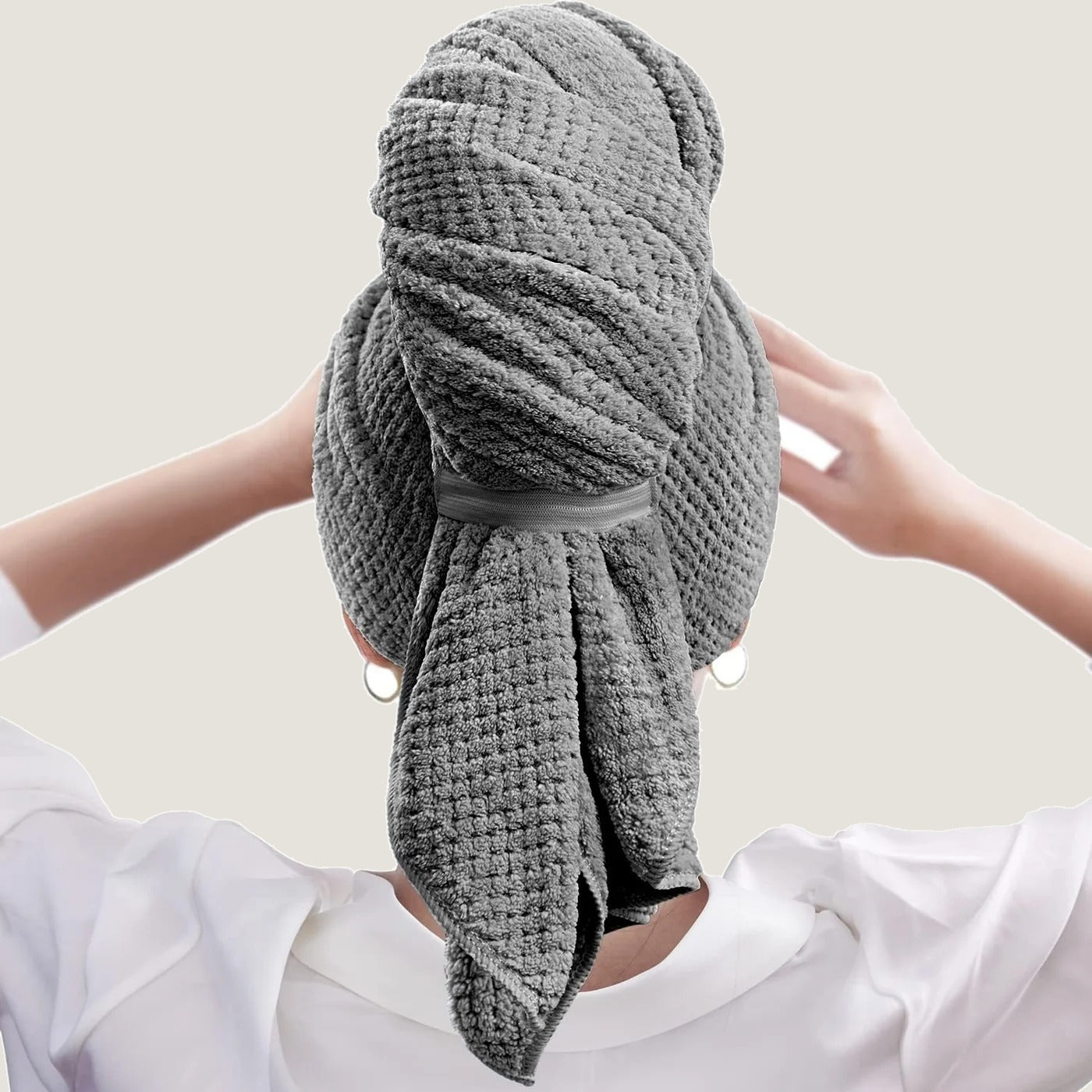 Microfiber hair towel worn, rear view showing elastic band closure